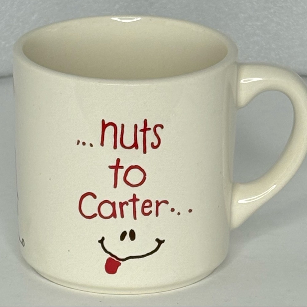 Jimmy Carter Playful Cream Mug with Red Text “Nuts To Carter”